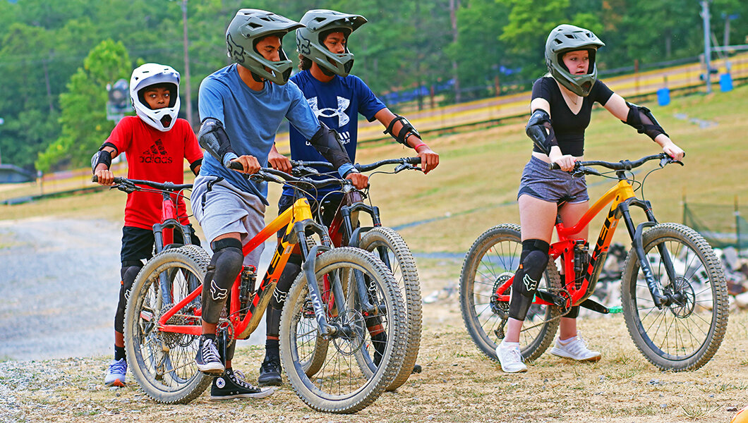 A group of guests taking a lesson at the  Mountain Bike Park